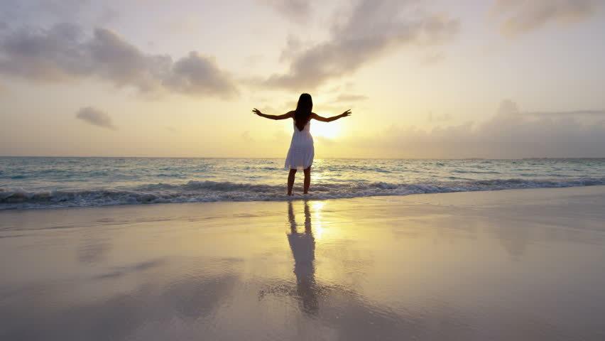 woman at beach resolving spiritual disconnect