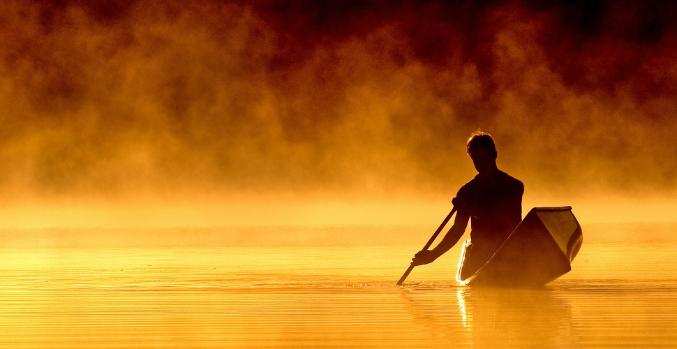 man in rowboat navigating life journey